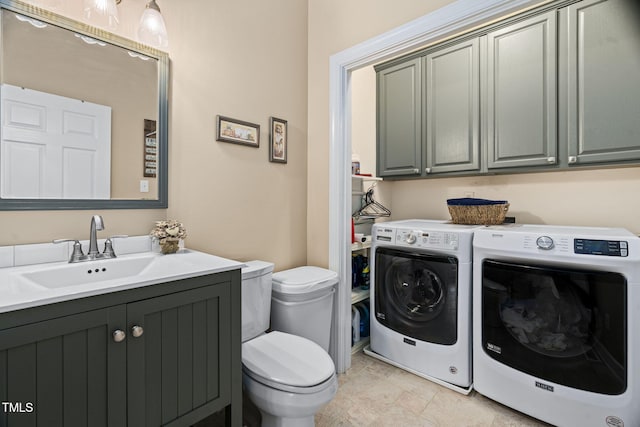 108 Cedarwood Dr, Louisburg, NC 27549 - bathroom featuring washer and clothes dryer, toilet, and vanity