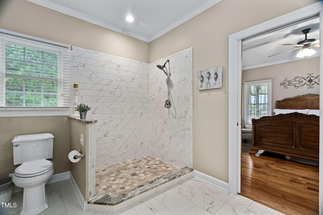 108 Cedarwood Dr, Louisburg, NC 27549 - full bathroom with tiled shower, toilet, ornamental molding, a ceiling fan, and baseboards