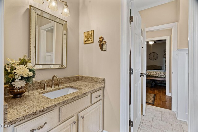 108 Cedarwood Dr, Louisburg, NC 27549 - bathroom with vanity, stone tile flooring, and connected bathroom