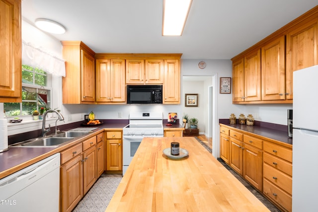 1166 NC Highway 87 N, Pittsboro, NC 27312 - kitchen featuring white appliances, a sink, and wooden counters