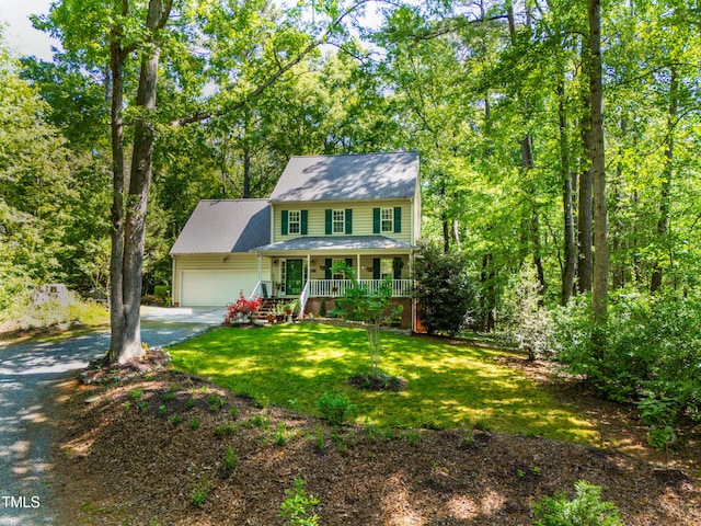 1166 NC Highway 87 N, Pittsboro, NC 27312 - colonial home with a porch, an attached garage, a front lawn, and aphalt driveway