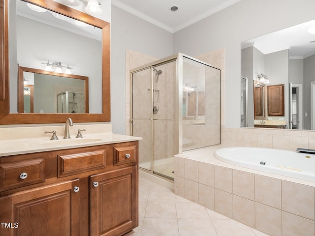 full bathroom featuring vanity, a stall shower, crown molding, tile patterned flooring, and a garden tub