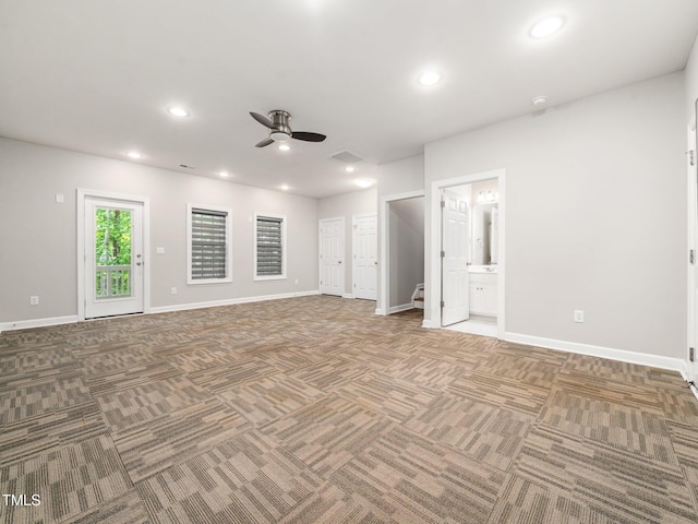 carpeted empty room with baseboards, a ceiling fan, and recessed lighting