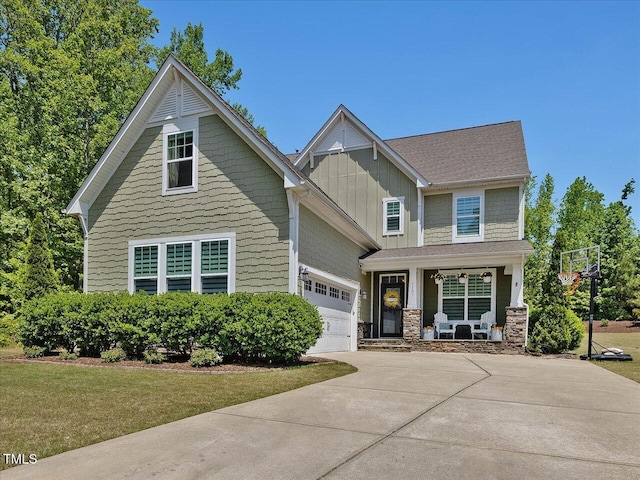 1701 Bodwin Ln, Apex, NC 27502 - craftsman inspired home with a porch, concrete driveway, board and batten siding, stone siding, and a front yard