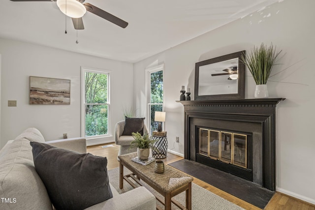 1605 Valley Run, Durham, NC 27707 - living room featuring ceiling fan, wood finished floors, a fireplace with flush hearth, and baseboards