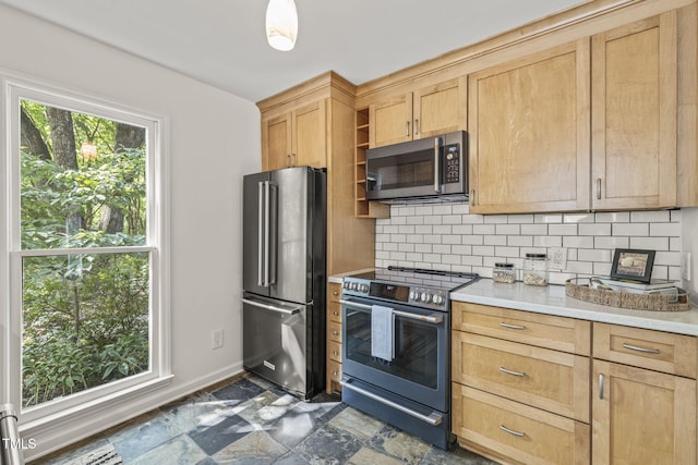 1605 Valley Run, Durham, NC 27707 - kitchen with stainless steel appliances, light countertops, backsplash, and light brown cabinetry