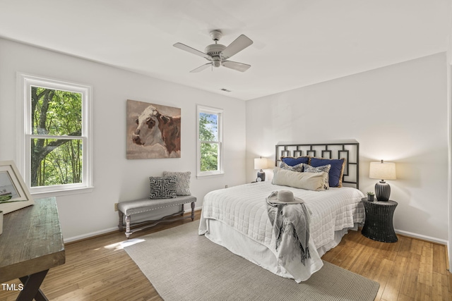 1605 Valley Run, Durham, NC 27707 - bedroom featuring baseboards, wood finished floors, and a ceiling fan