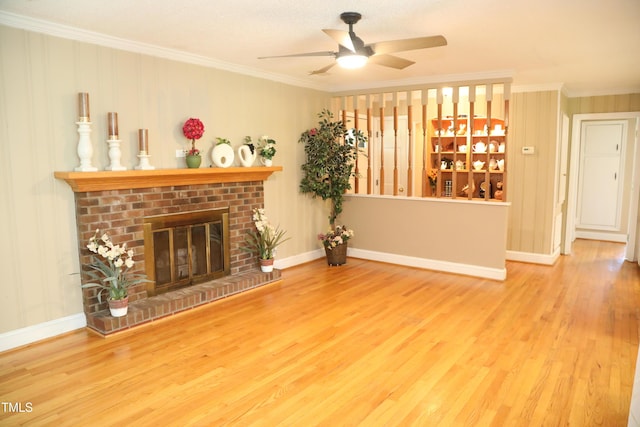 1927 Simpkins Rd, Raleigh, NC 27603 - living room with ornamental molding, wood finished floors, a ceiling fan, and a brick fireplace