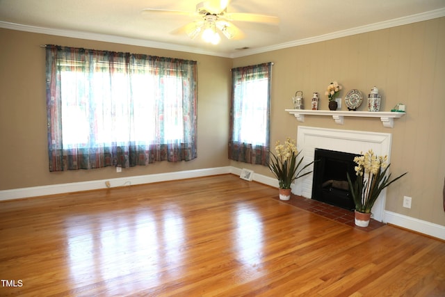 1927 Simpkins Rd, Raleigh, NC 27603 - unfurnished living room featuring a fireplace with flush hearth, crown molding, a ceiling fan, and wood finished floors