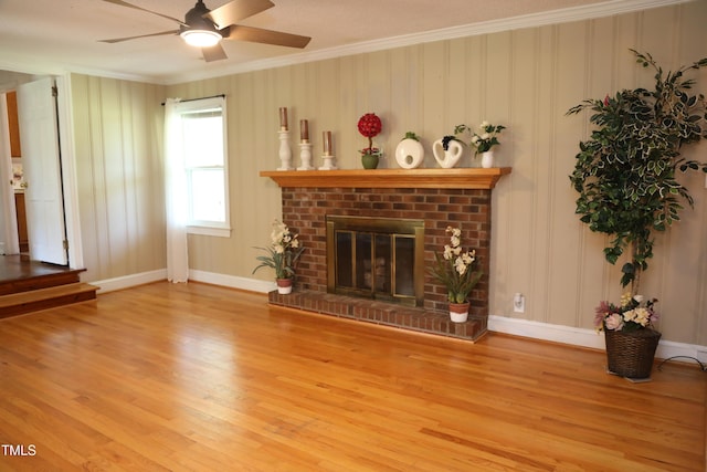 1927 Simpkins Rd, Raleigh, NC 27603 - unfurnished living room featuring crown molding, light wood-type flooring, a ceiling fan, and a fireplace