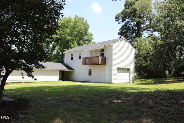 1927 Simpkins Rd, Raleigh, NC 27603 - view of property exterior with a balcony, a garage, a yard, and a shingled roof