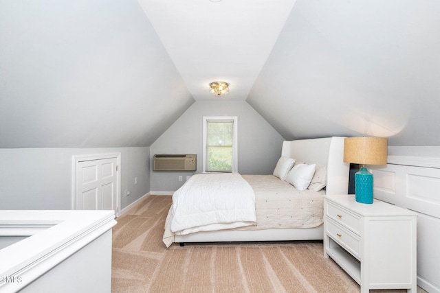 bedroom with a wall unit AC, vaulted ceiling, and light carpet