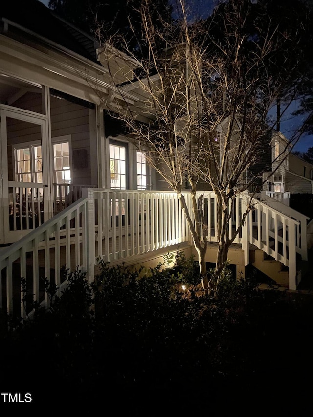 property exterior at night with stairway