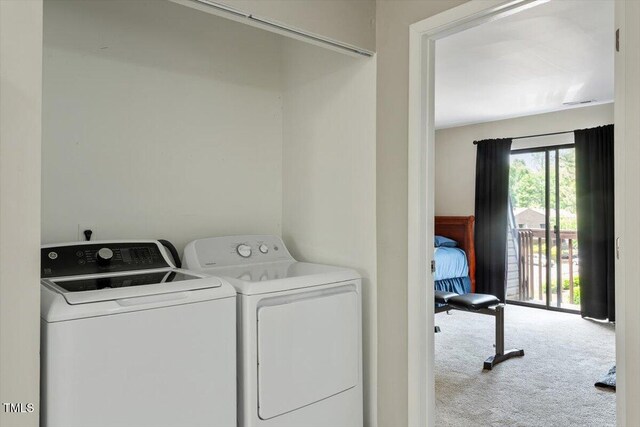 laundry room with separate washer and dryer, laundry area, and carpet floors