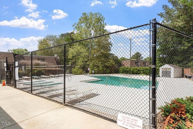 community pool featuring fence