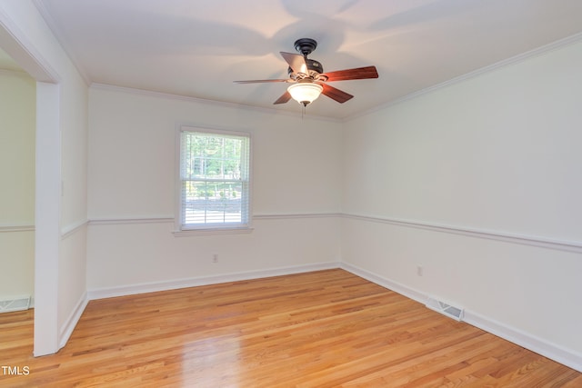 unfurnished room with a ceiling fan, baseboards, visible vents, and light wood-type flooring