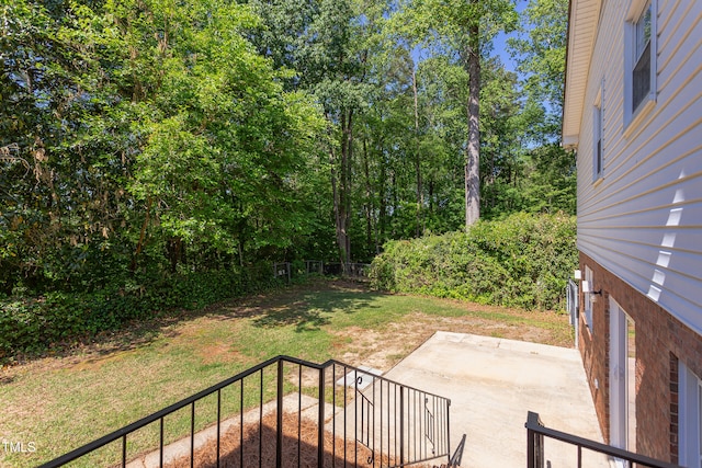 view of yard featuring fence and a patio area