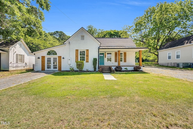 105 N 11th St, Erwin, NC 28339 - view of front of home with covered porch, a standing seam roof, french doors, metal roof, and a front lawn