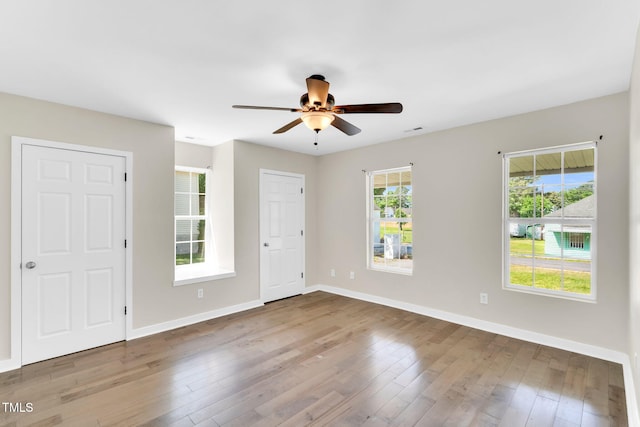 105 N 11th St, Erwin, NC 28339 - empty room with baseboards, a ceiling fan, wood finished floors, and visible vents
