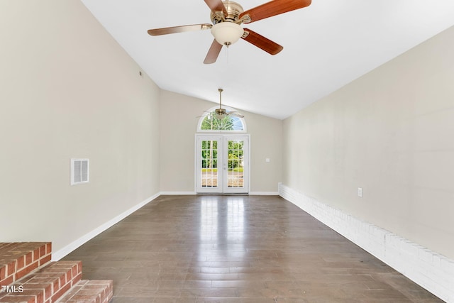 105 N 11th St, Erwin, NC 28339 - unfurnished living room featuring ceiling fan, french doors, lofted ceiling, dark wood-type flooring, and visible vents