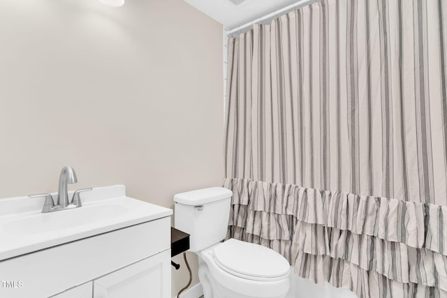 105 N 11th St, Erwin, NC 28339 - full bathroom featuring vanity, toilet, and curtained shower