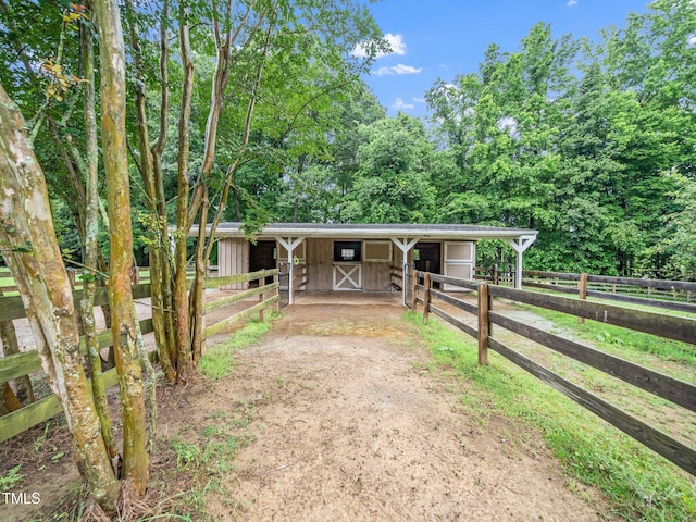 12823 Summerwind Trl, Rougemont, NC 27572 - view of front facade with an exterior structure, an outbuilding, driveway, and an attached carport