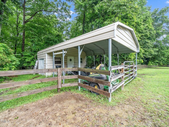12823 Summerwind Trl, Rougemont, NC 27572 - view of front facade featuring an exterior structure, dirt driveway, and an outbuilding