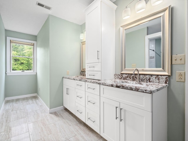 12823 Summerwind Trl, Rougemont, NC 27572 - full bathroom with double vanity and baseboards