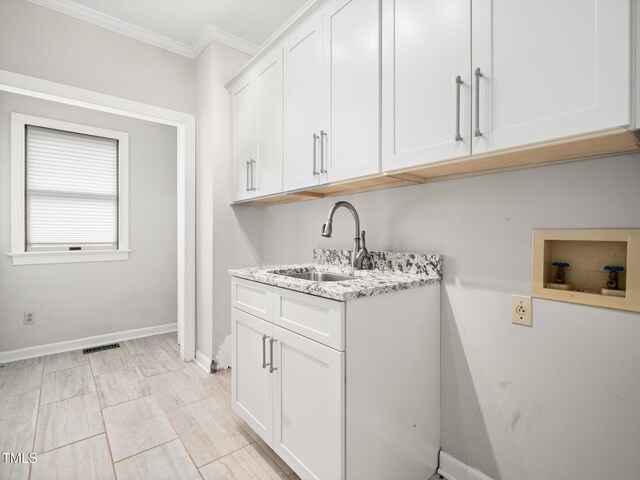 12823 Summerwind Trl, Rougemont, NC 27572 - laundry area with washer hookup, cabinet space, ornamental molding, and baseboards