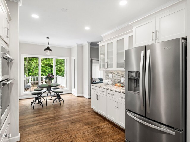 12823 Summerwind Trl, Rougemont, NC 27572 - kitchen with stainless steel fridge, recessed lighting, white cabinets, backsplash, and crown molding