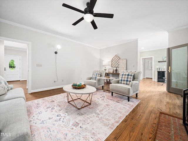 12823 Summerwind Trl, Rougemont, NC 27572 - living area with crown molding, wood finished floors, a ceiling fan, and baseboards