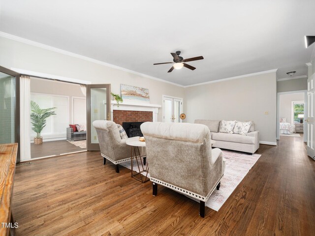 12823 Summerwind Trl, Rougemont, NC 27572 - living area with a ceiling fan, a fireplace, wood finished floors, crown molding, and baseboards