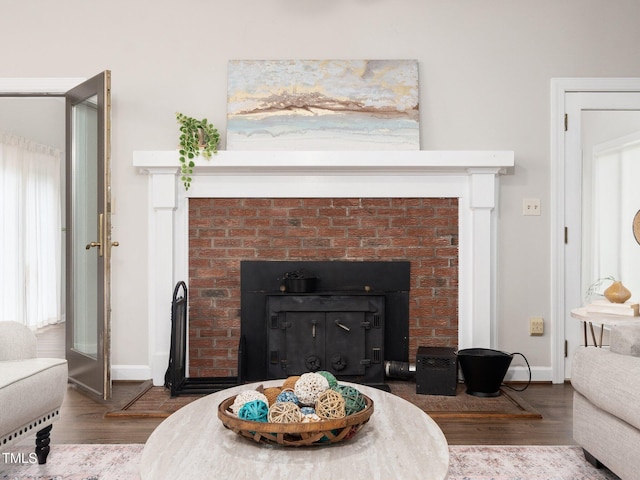 12823 Summerwind Trl, Rougemont, NC 27572 - living area featuring a fireplace, wood finished floors, and baseboards