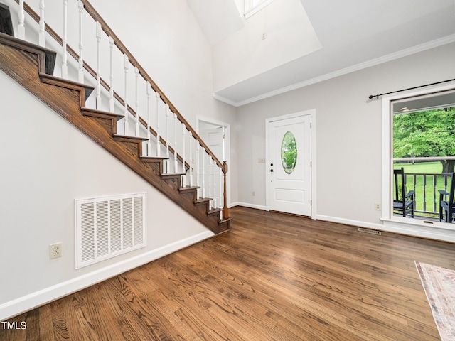 12823 Summerwind Trl, Rougemont, NC 27572 - foyer with plenty of natural light, wood finished floors, baseboards, crown molding, and a high ceiling