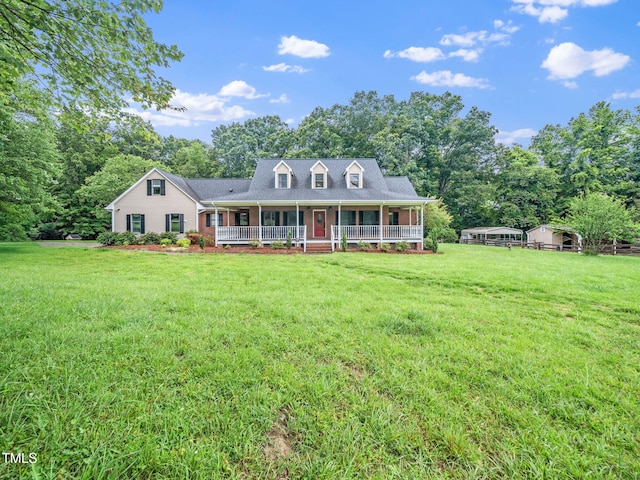 12823 Summerwind Trl, Rougemont, NC 27572 - cape cod-style house featuring a porch, a front yard, and view of scattered trees
