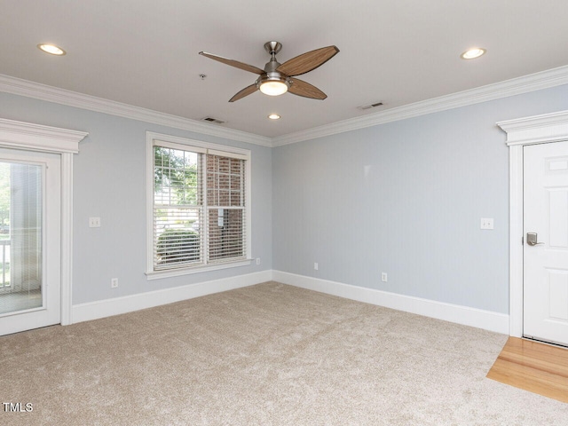 carpeted spare room with visible vents, ornamental molding, a ceiling fan, and recessed lighting