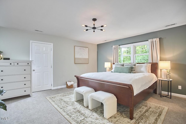 bedroom featuring carpet flooring, baseboards, visible vents, and an inviting chandelier