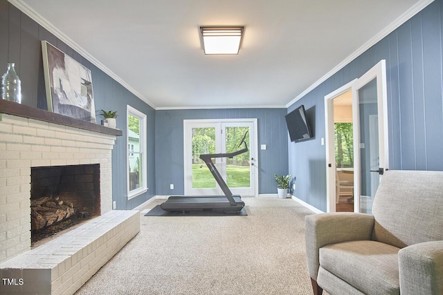living area with baseboards, ornamental molding, carpet, and a fireplace