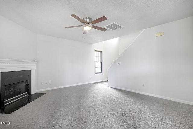 unfurnished living room with a ceiling fan, baseboards, visible vents, and carpet