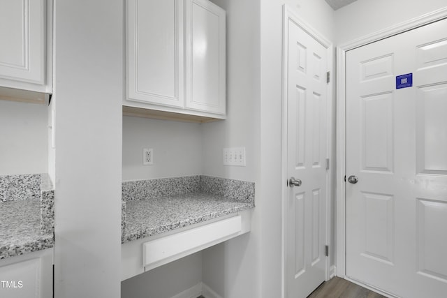 entryway with dark wood-style floors