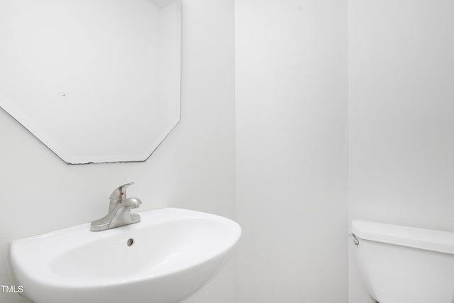 bathroom with a sink and toilet