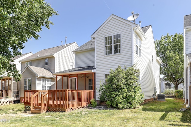 rear view of house featuring a lawn, a deck, central AC, and a ceiling fan