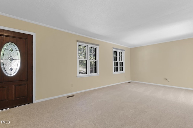 101 Atchison St, Garner, NC 27529 - entryway featuring crown molding, baseboards, and light carpet