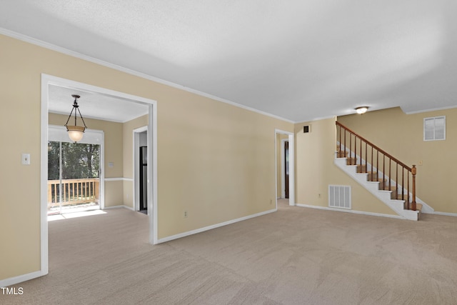 101 Atchison St, Garner, NC 27529 - unfurnished living room with crown molding, stairway, carpet, and visible vents