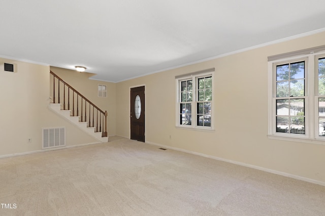 101 Atchison St, Garner, NC 27529 - entryway featuring visible vents, crown molding, stairs, baseboards, and carpet