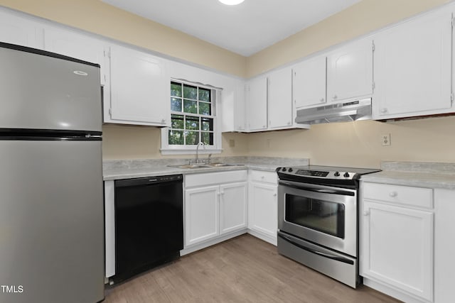 101 Atchison St, Garner, NC 27529 - kitchen featuring appliances with stainless steel finishes, a sink, light countertops, under cabinet range hood, and white cabinetry