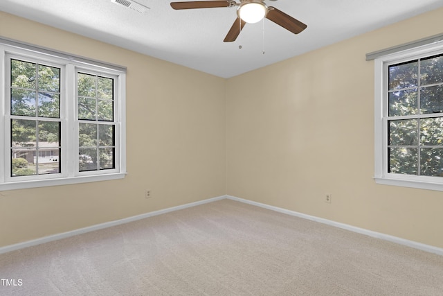 101 Atchison St, Garner, NC 27529 - carpeted spare room with visible vents, baseboards, ceiling fan, and a healthy amount of sunlight