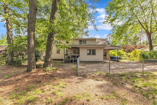 back of property featuring fence and a deck