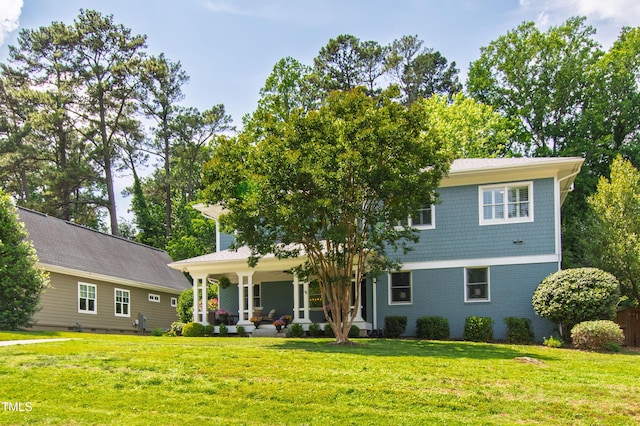 2517 Medway Dr, Raleigh, NC 27608 - view of front of property featuring covered porch, brick siding, and a front lawn