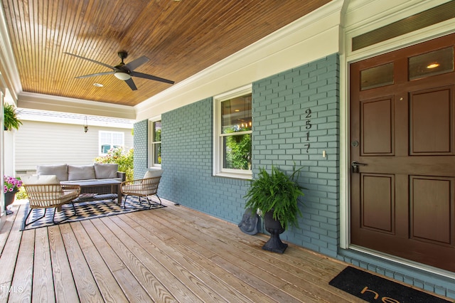 2517 Medway Dr, Raleigh, NC 27608 - wooden deck featuring a ceiling fan, outdoor lounge area, and covered porch